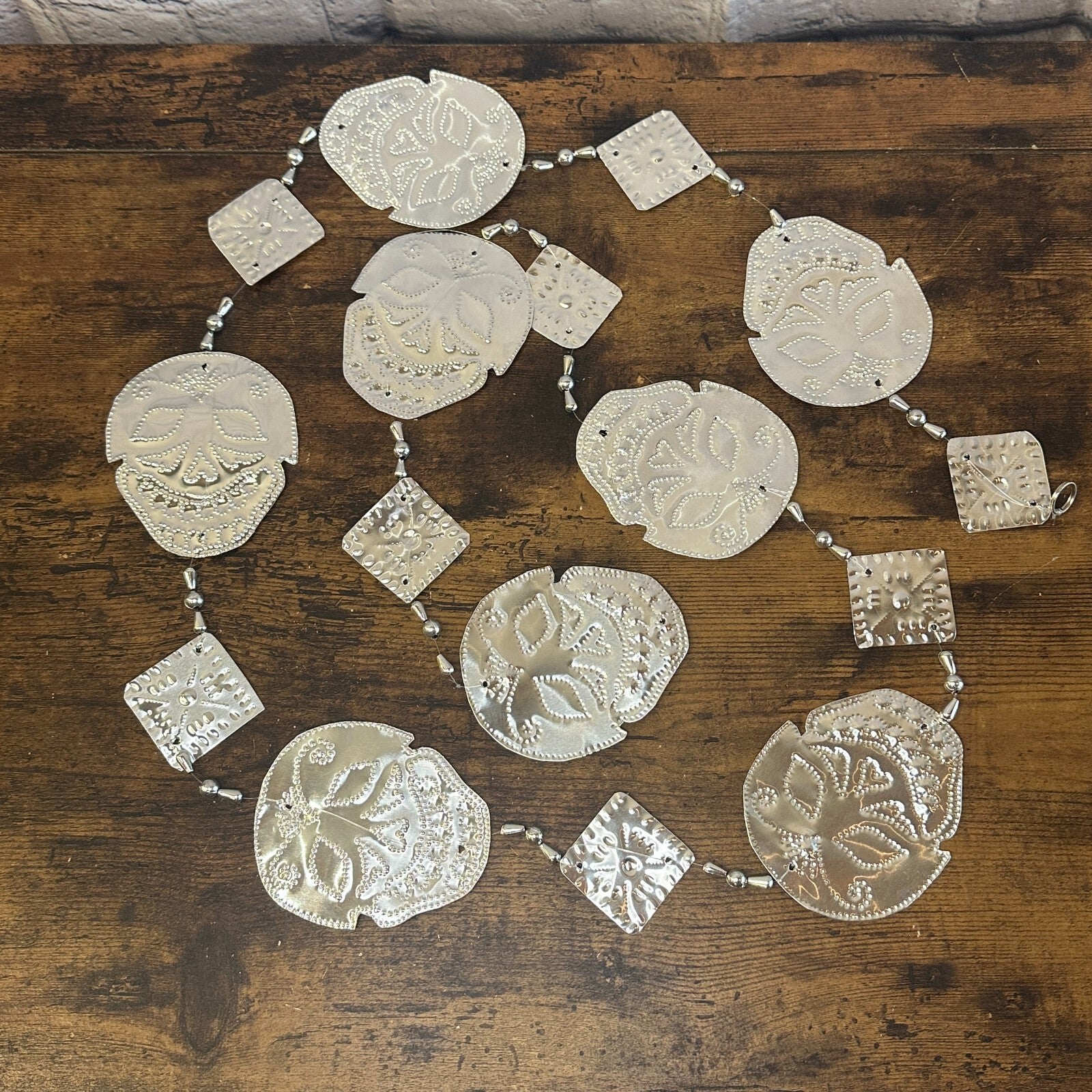 Aluminium Stamped Sitting Skull String Wall & Door Hangings for Home Decoration0