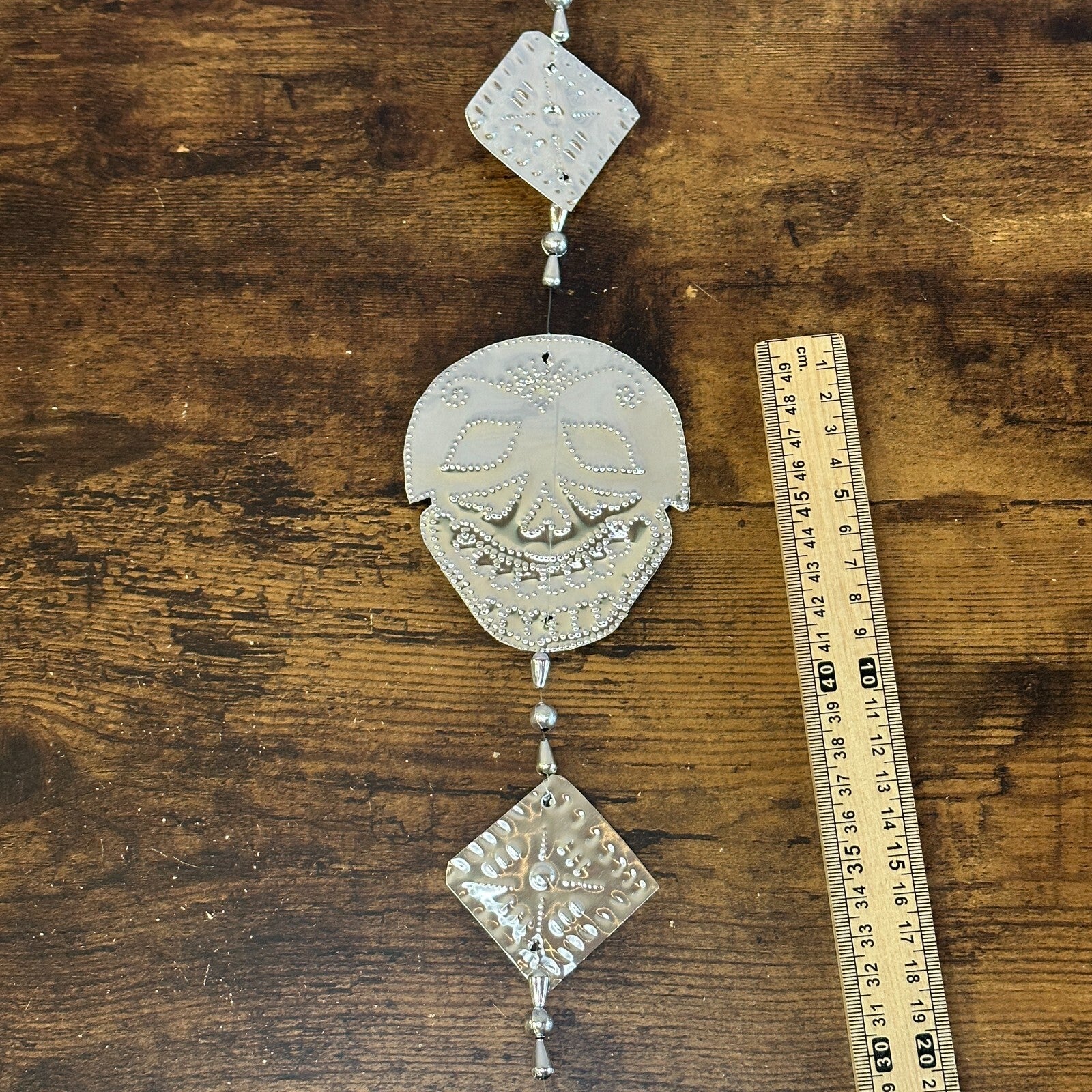 Aluminium Stamped Sitting Skull String Wall & Door Hangings for Home Decoration2